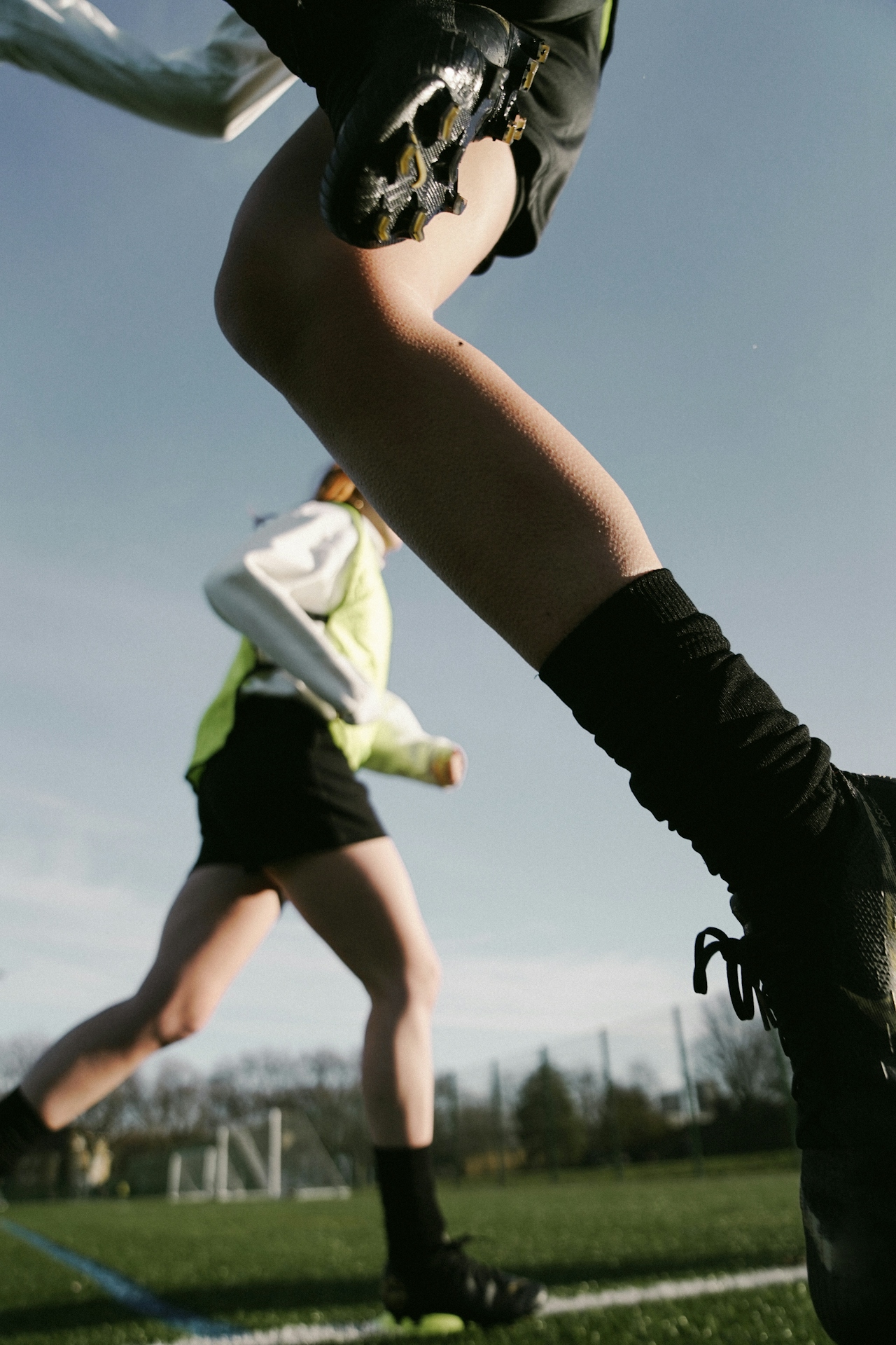 Person running on a sports field